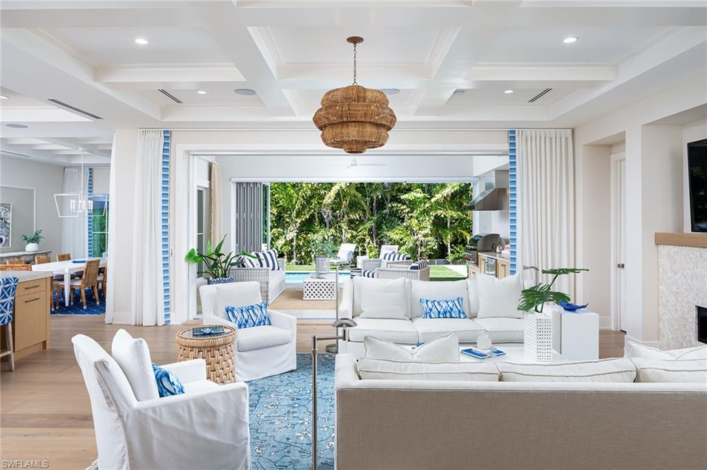 1040 2nd Street South Naples, FL 34102 - Photo 4 of 42 a living room with furniture and a large window