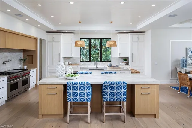 a kitchen with a stove a sink and a refrigerator