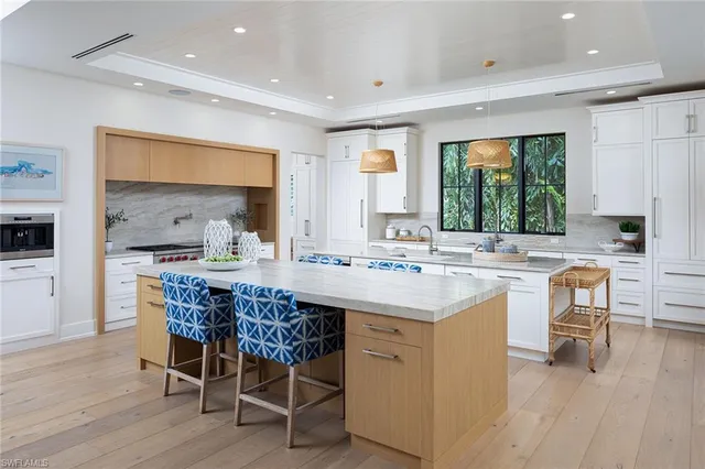 a kitchen with a sink a counter top space and appliances
