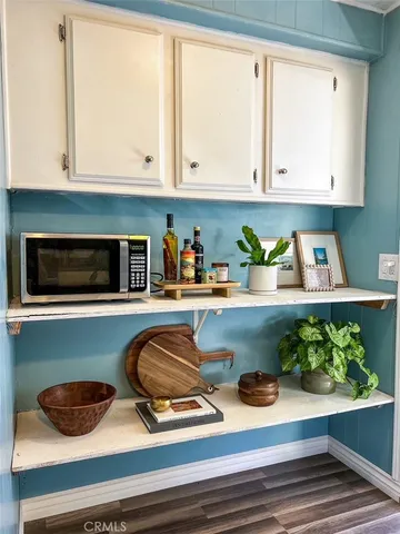 a kitchen with a stove and cabinets