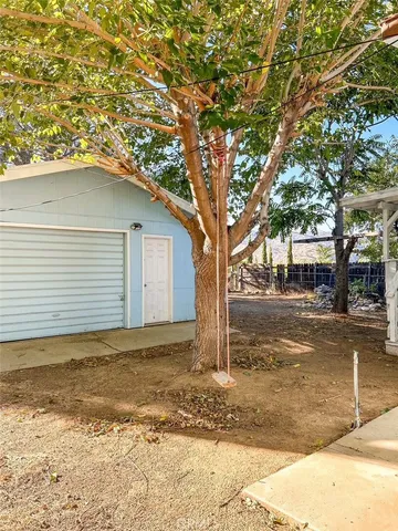 a view of a house with a yard covered with snow