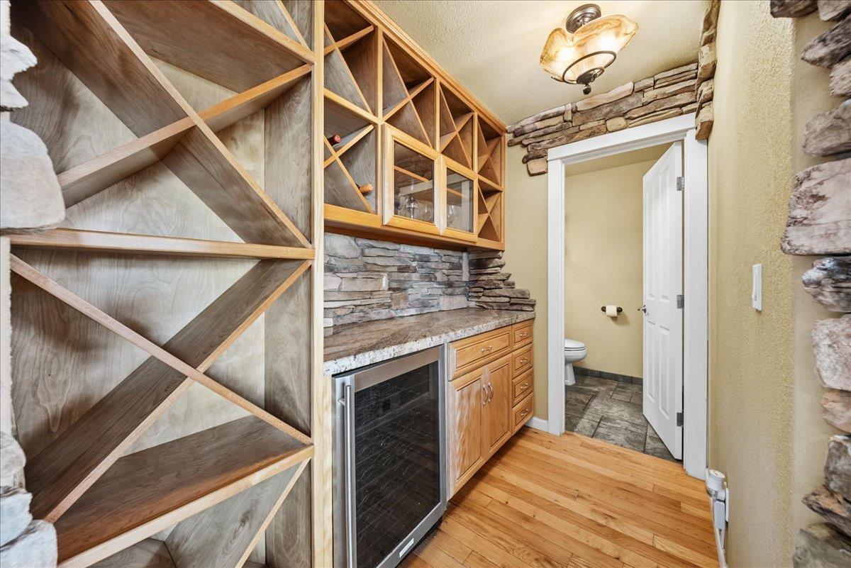 16035 Running Springs Road Grass Valley, CA 95949 - Photo 14 of 94 a view of a hallway with wooden floor and staircase