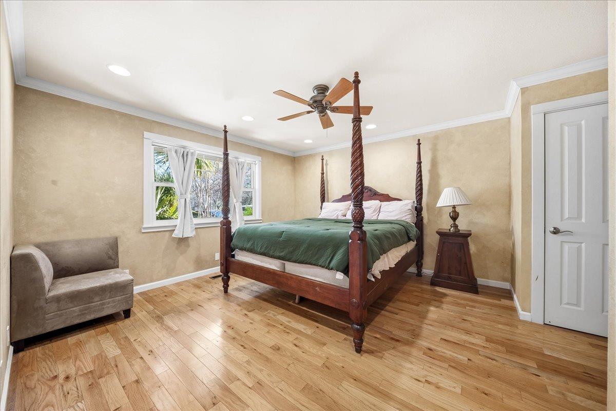 16035 Running Springs Road Grass Valley, CA 95949 - Photo 16 of 94 a bedroom with a bed and a couch
