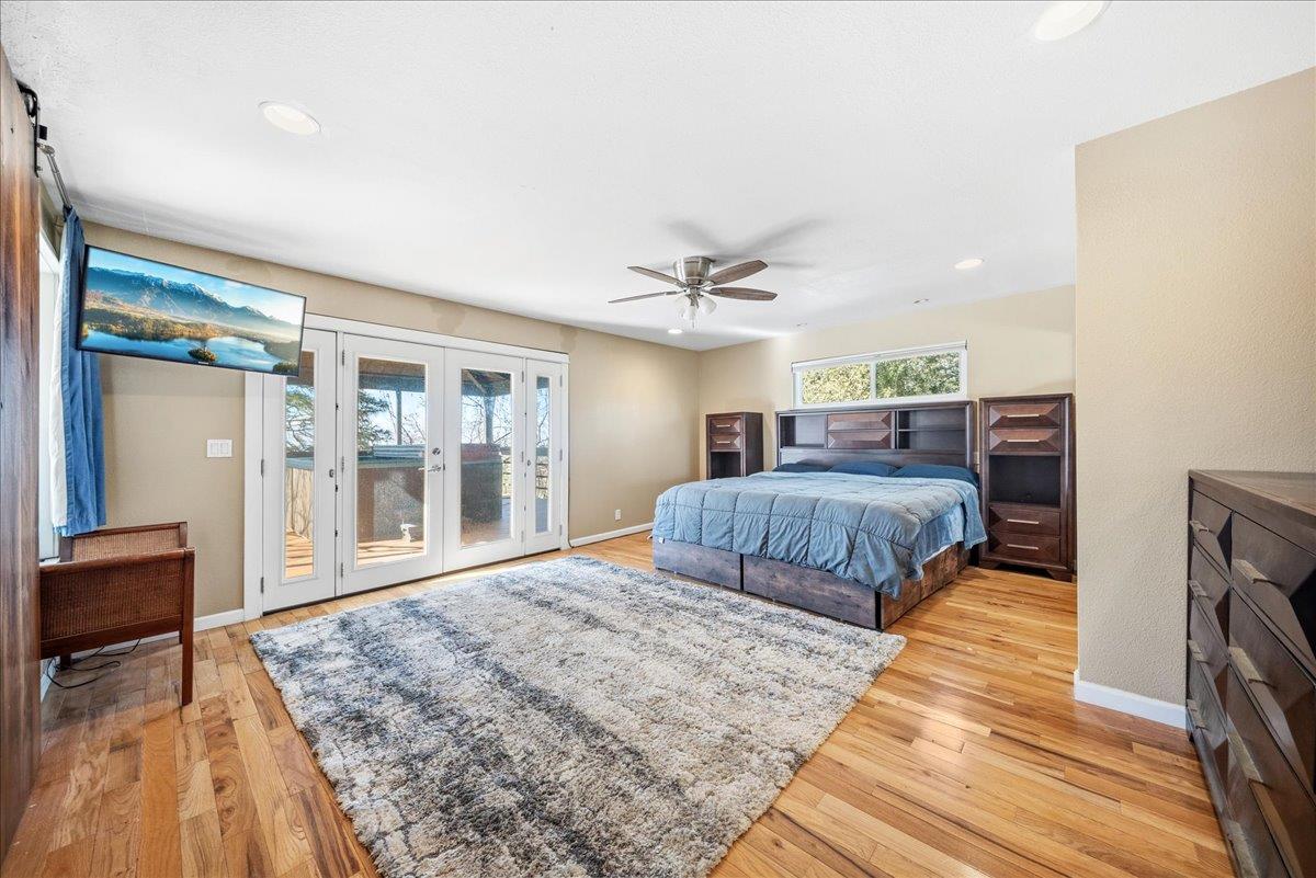 16035 Running Springs Road Grass Valley, CA 95949 - Photo 20 of 94 a bedroom with a large bed and a dresser