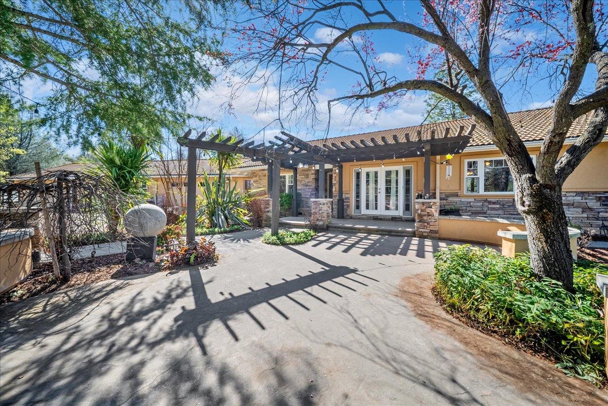16035 Running Springs Road Grass Valley, CA 95949 - Photo 2 of 94 a front view of a house with garden and patio