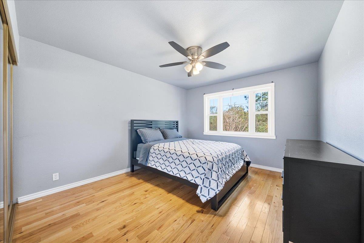 16035 Running Springs Road Grass Valley, CA 95949 - Photo 25 of 94 a bedroom with a bed and a window