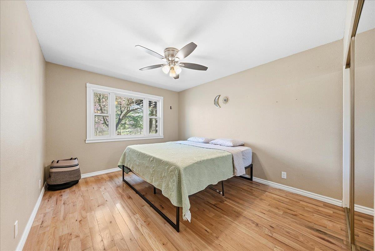 16035 Running Springs Road Grass Valley, CA 95949 - Photo 27 of 94 a bedroom with a bed and a window