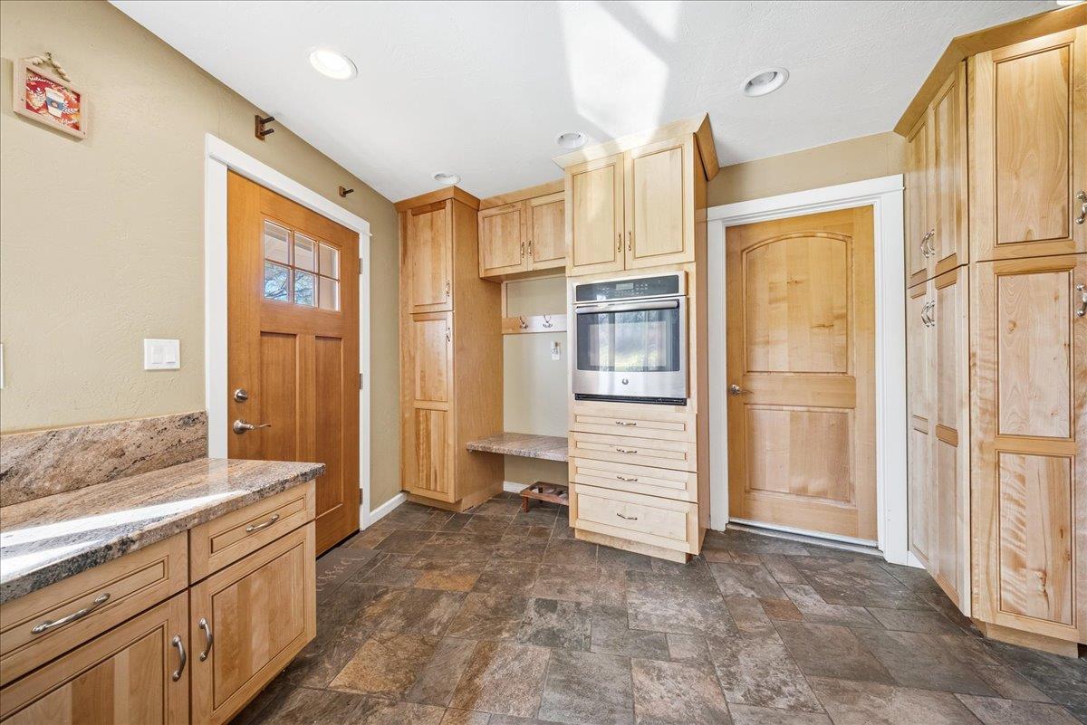 16035 Running Springs Road Grass Valley, CA 95949 - Photo 32 of 94 a bathroom with a granite countertop sink mirror and a shower