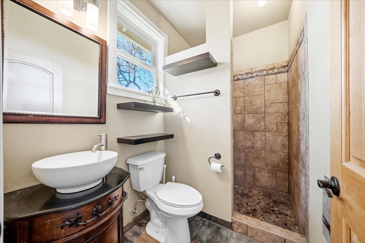 16035 Running Springs Road Grass Valley, CA 95949 - Photo 41 of 94 a bathroom with a sink toilet and shower