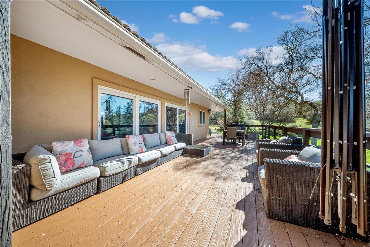 16035 Running Springs Road Grass Valley, CA 95949 - Photo 49 of 94 a view of a patio with couches chairs and wooden floor