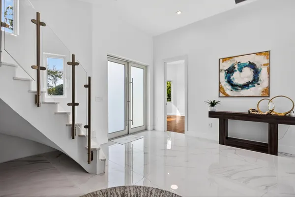 a view of a hallway with a chandelier