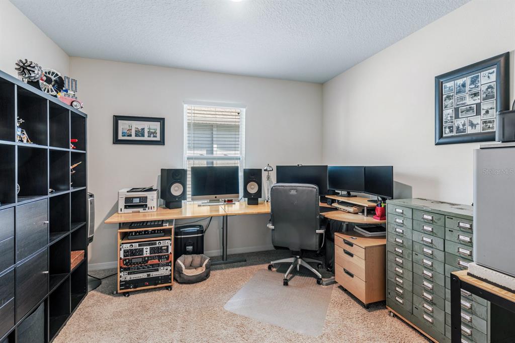 5381 Hickory Downs Way St. Cloud, FL 34771 - Photo 25 of 35 a view of a workspace with furniture