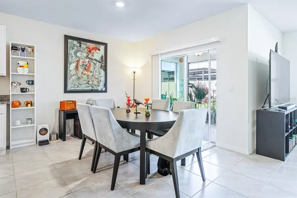 a dining room with furniture and window