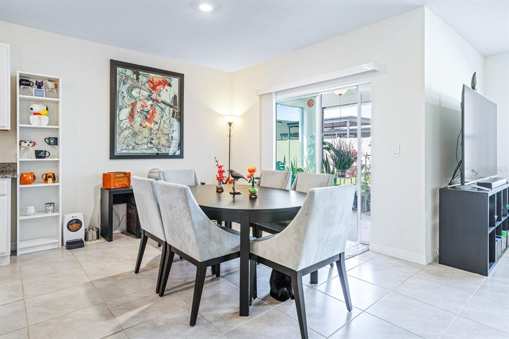5381 Hickory Downs Way St. Cloud, FL 34771 - Photo 9 of 35 a dining room with furniture and window