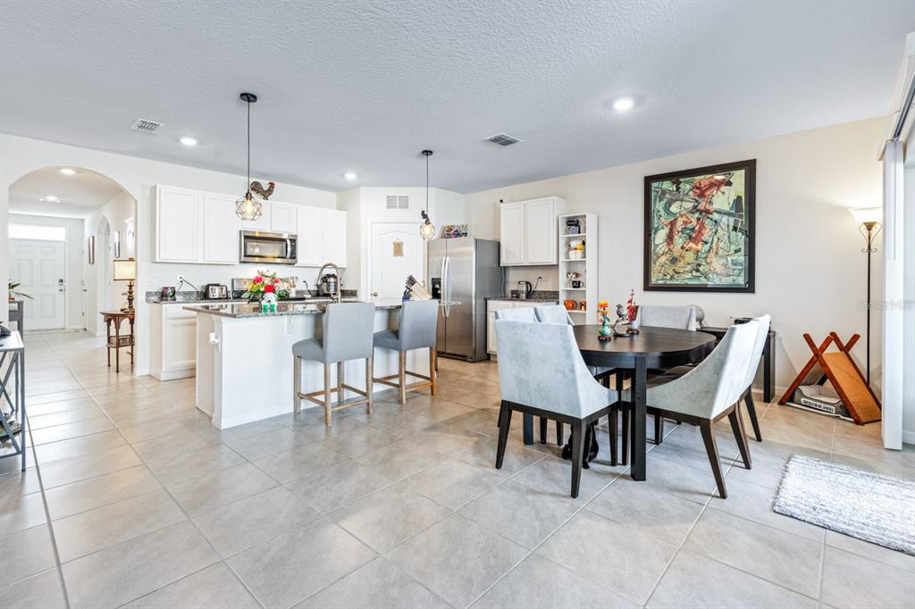 5381 Hickory Downs Way St. Cloud, FL 34771 - Photo 10 of 35 a view of a dining room with furniture