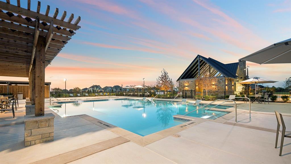 3324 Barnard Road Celina, TX 75009 - Photo 10 of 11 a view of a lake with a table and chairs on the roof deck