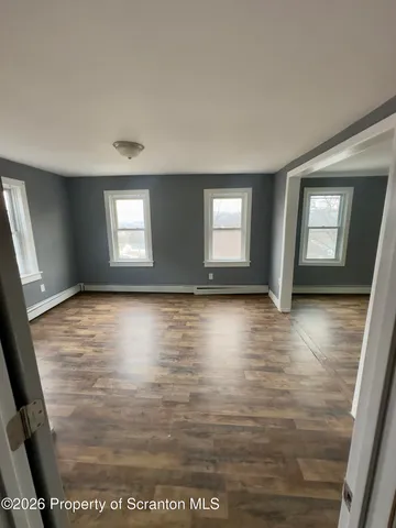 a view of a living room and dining room