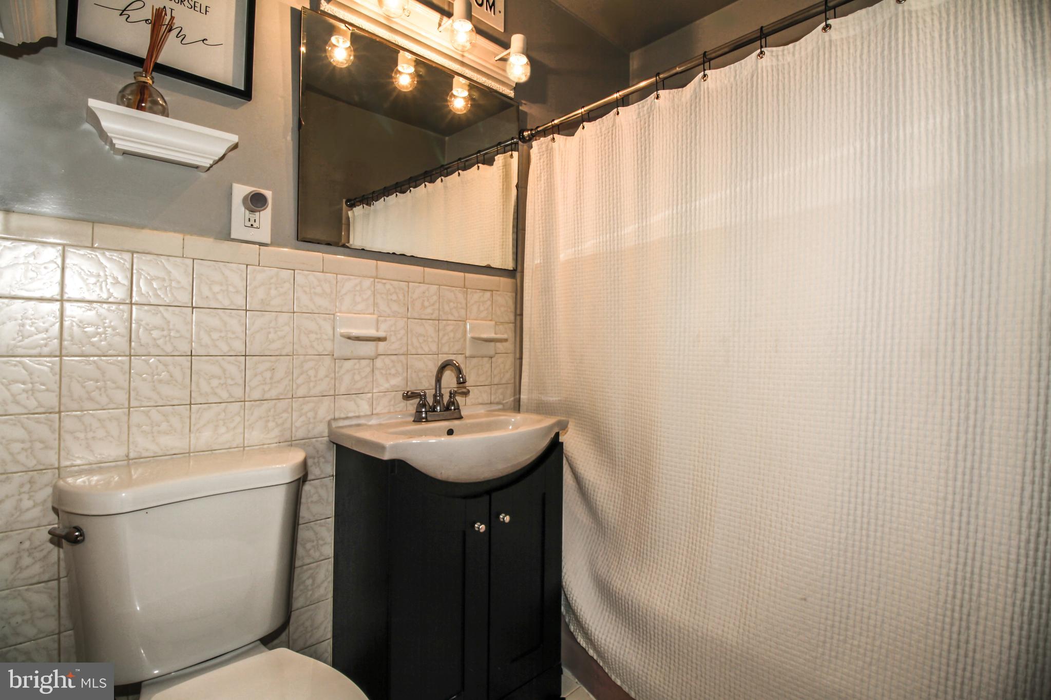 8147 Elizabeth Road Pasadena, MD 21122 - Photo 13 of 23 Hall Bathroom