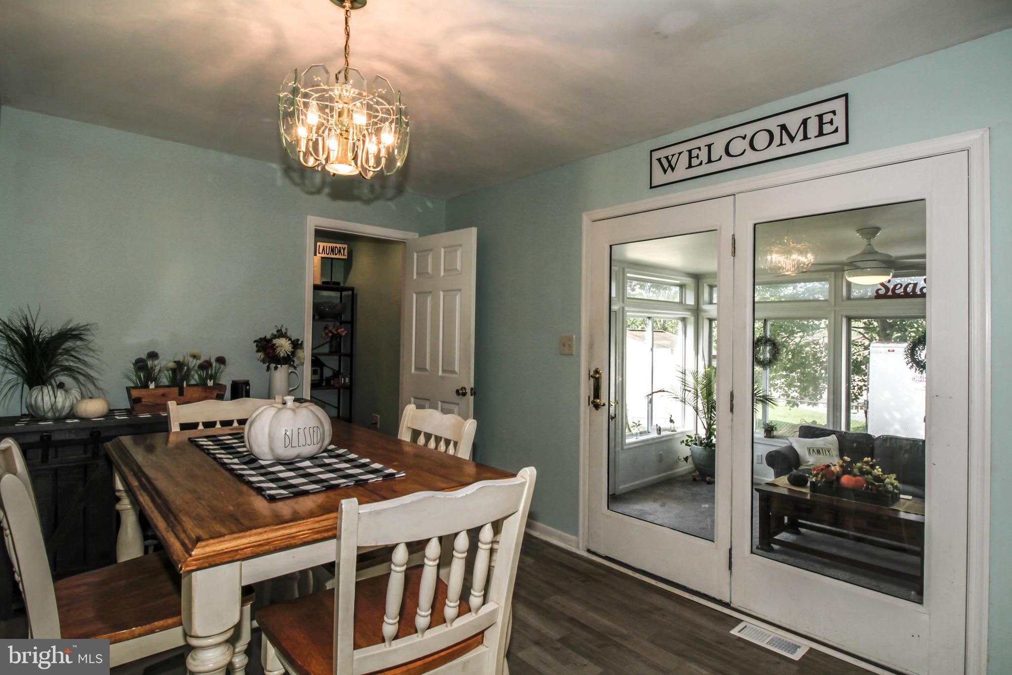 8147 Elizabeth Road Pasadena, MD 21122 - Photo 10 of 23 Breakfast Nook leading to the sunroom