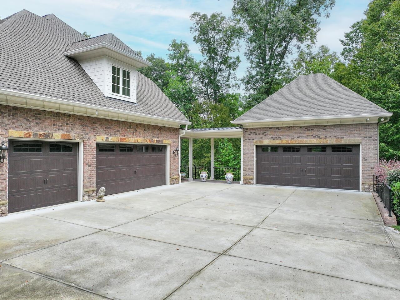 11216 Jonas Ridge Lane Raleigh, NC 27613 - Photo 30 of 75 Five car garage 3 attached and 2 car detached with below grade storage area