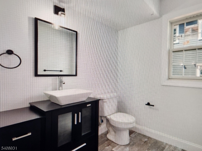 30 8th Street Frenchtown, NJ 08825 - Photo 15 of 17 a bathroom with a toilet a sink and mirror