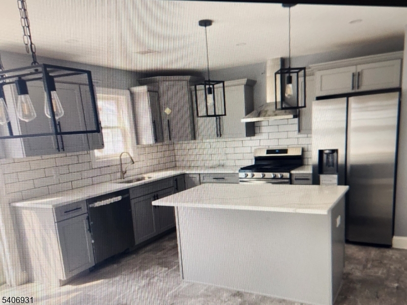 30 8th Street Frenchtown, NJ 08825 - Photo 9 of 17 a kitchen with kitchen island a sink stainless steel appliances and cabinets