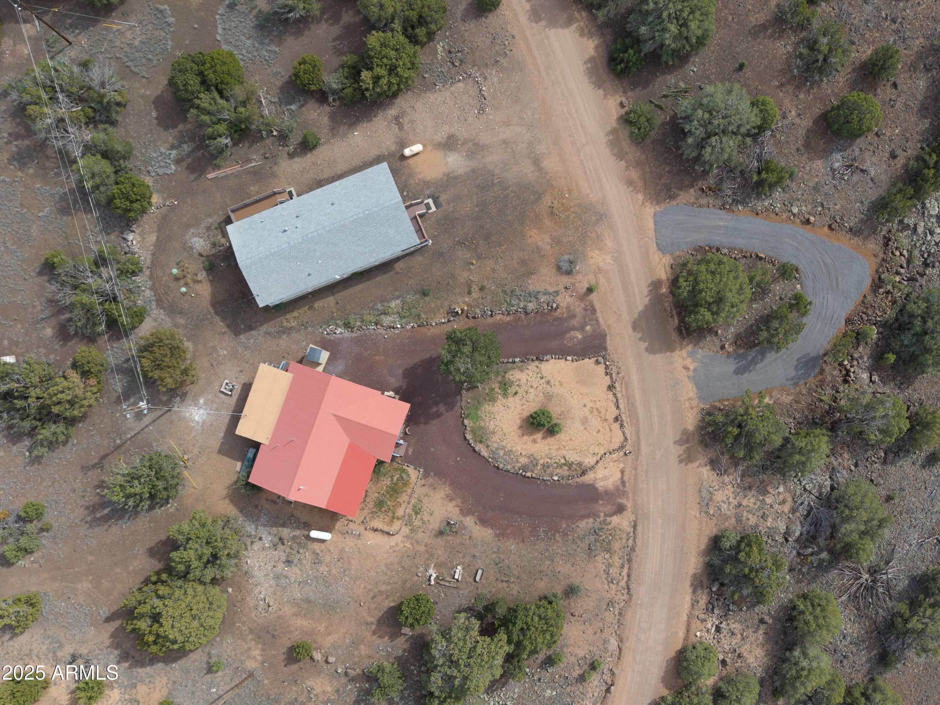 8286 Ridge Drive Show Low, AZ 85901 - Photo 18 of 21 an aerial view of a house with a yard and sitting area