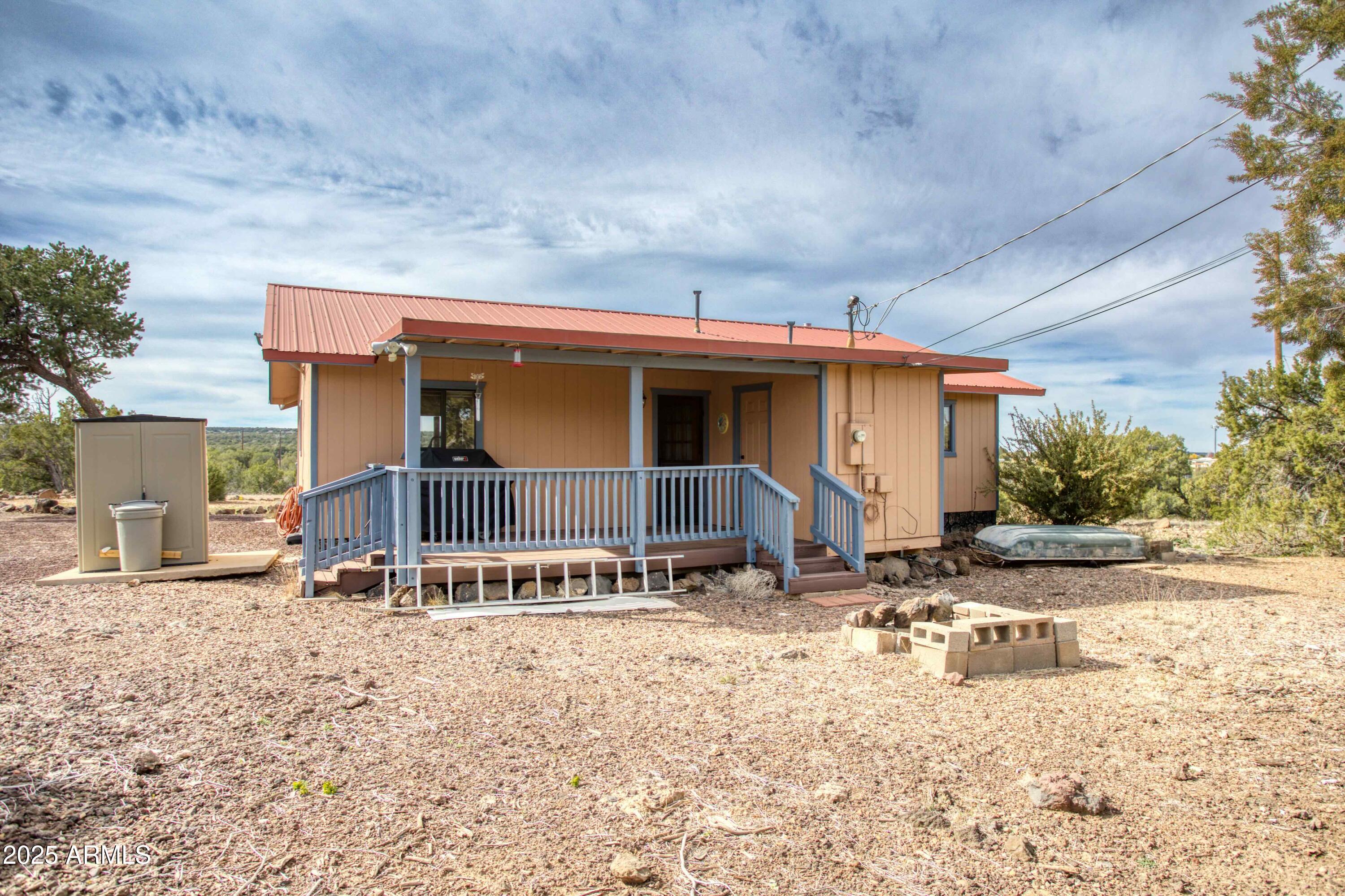 8286 Ridge Drive Show Low, AZ 85901 - Photo 20 of 21 a view of a house with backyard and sitting area