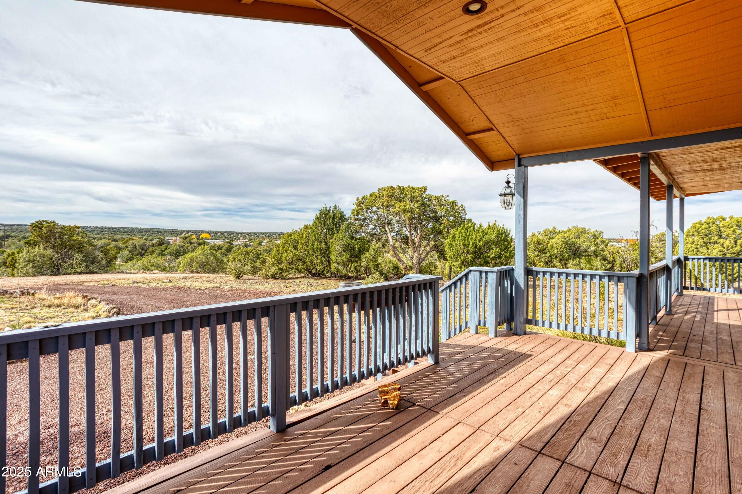 8286 Ridge Drive Show Low, AZ 85901 - Photo 3 of 21 a view of balcony with wooden floor