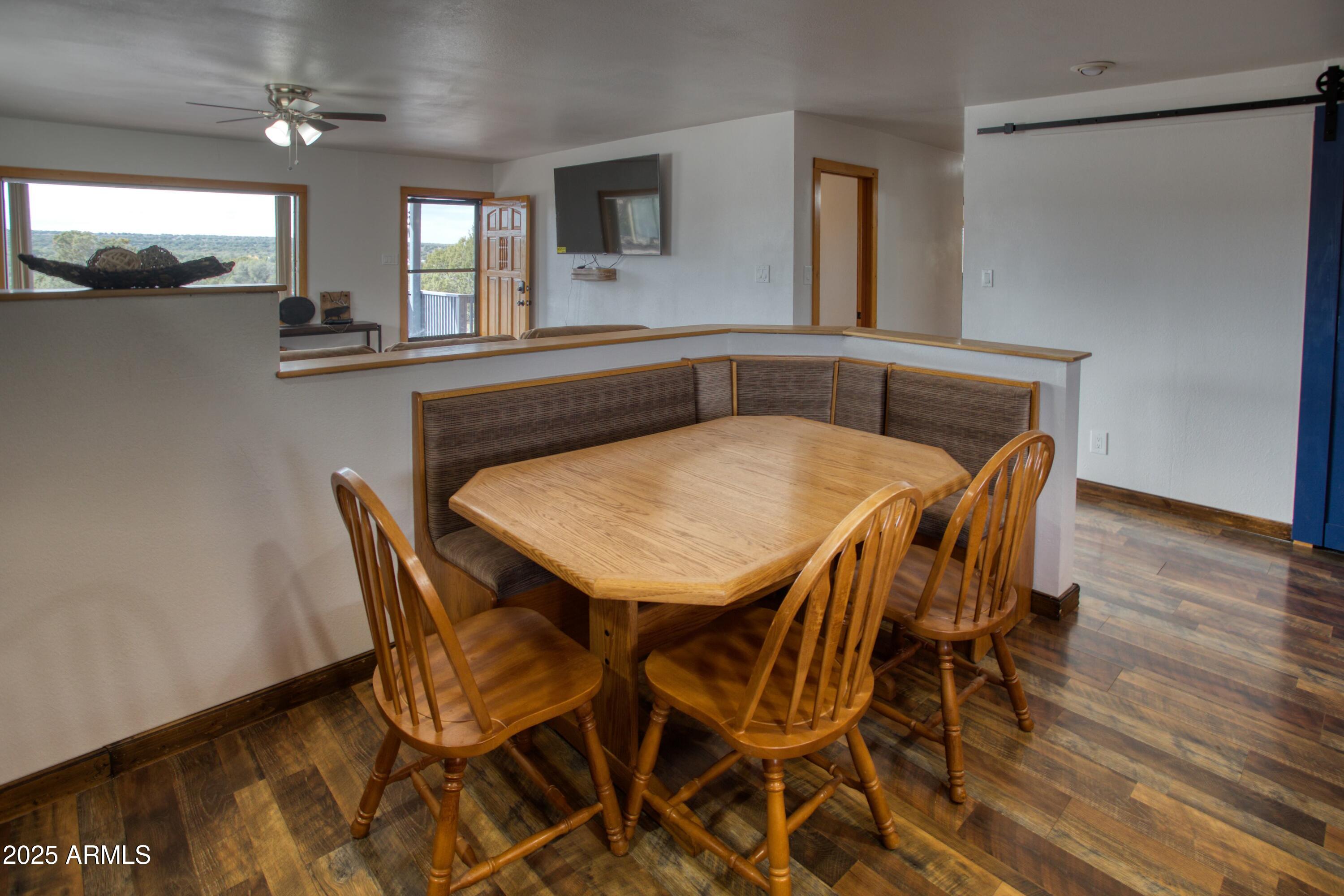 8286 Ridge Drive Show Low, AZ 85901 - Photo 7 of 21 a view of a dining room with furniture and window
