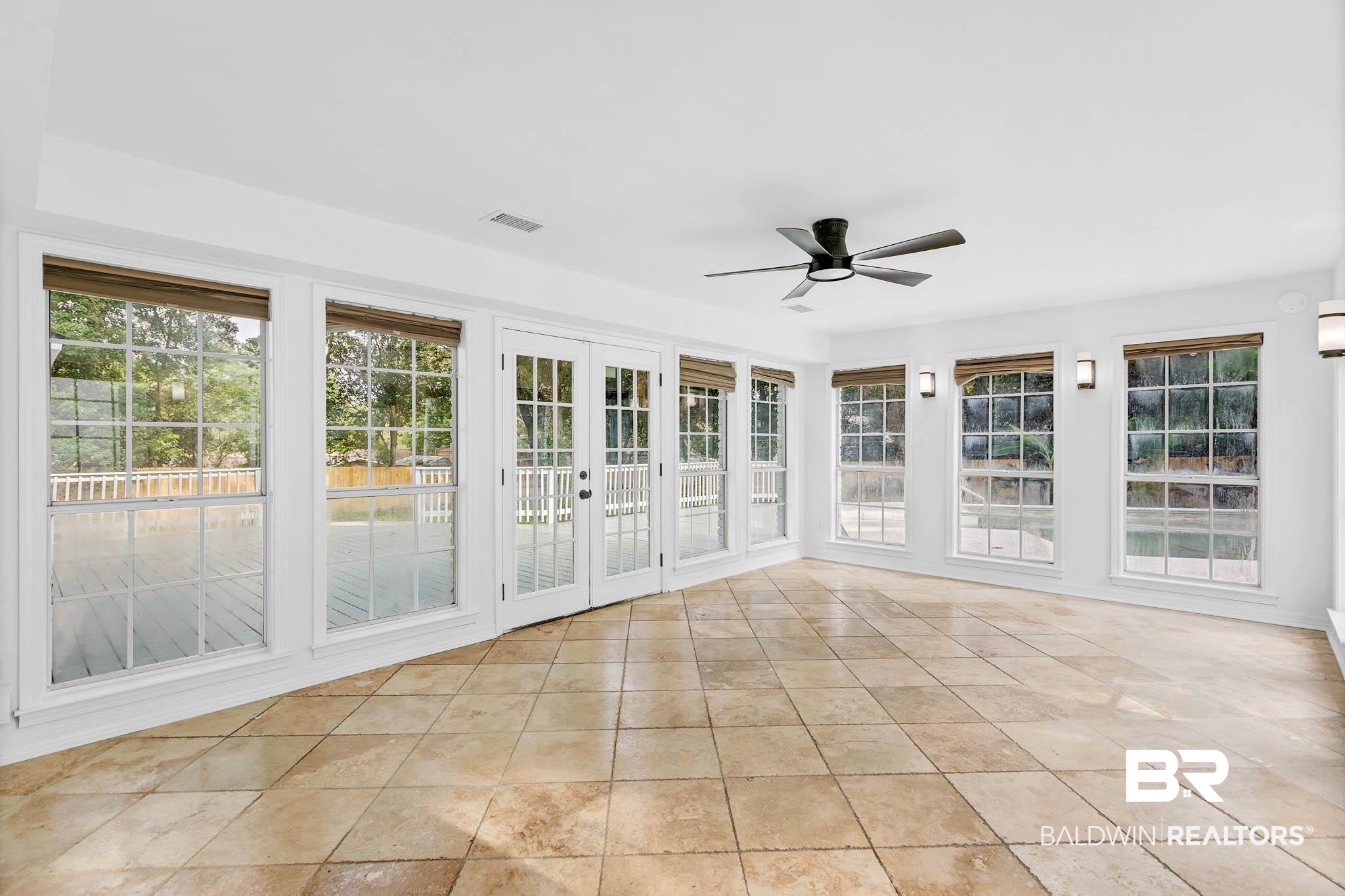 4705 Sherry Court Mobile, AL 36693 - Photo 28 of 100 Unfurnished sunroom with french doors and tile patterned flooring