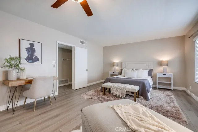 a bedroom with a bed and a chair