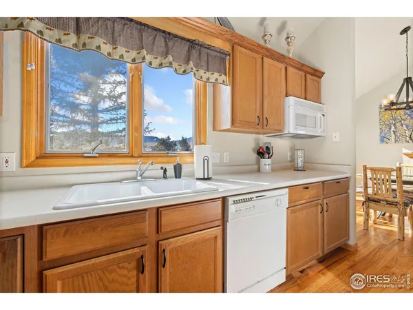 a kitchen with stainless steel appliances a sink stove and cabinets