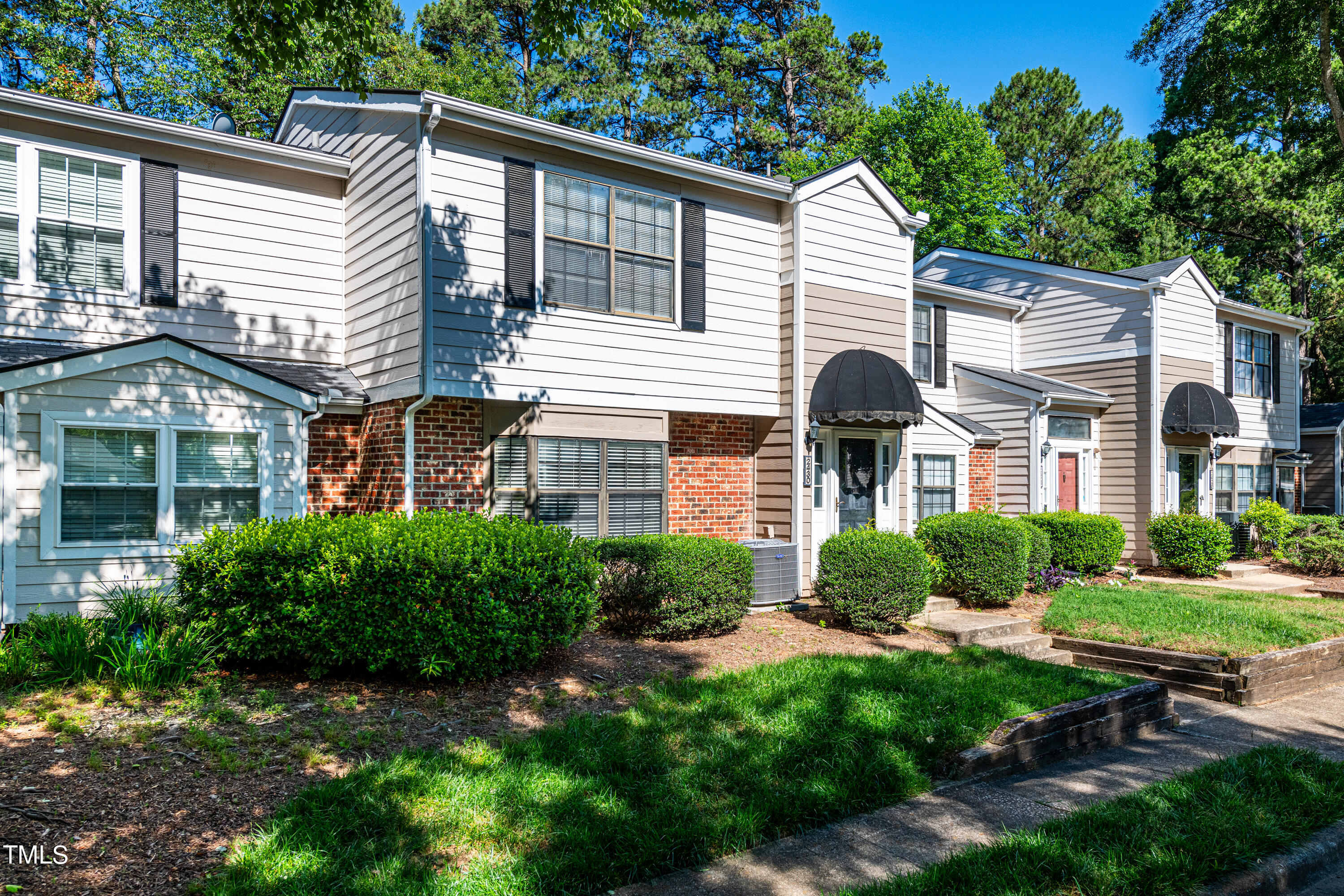 2430 Condor Court Raleigh, NC 27615 - Photo 2 of 37 a front view of a house with garden