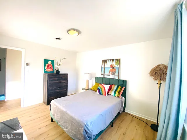 a bedroom with a bed and a book shelf