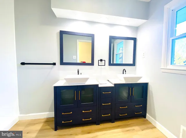 a bathroom with a sink and mirror