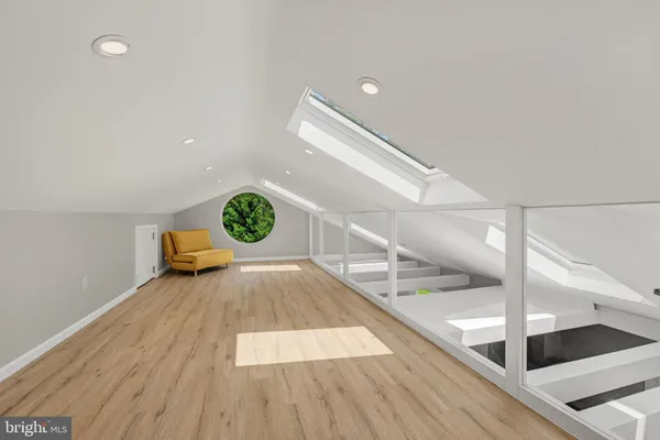 a view of an empty room and wooden floor