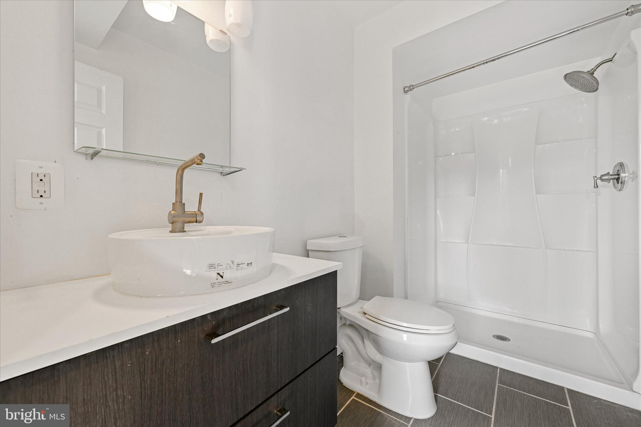 10533 Stevenson Road Stevenson, MD 21153 - Photo 32 of 45 a bathroom with a sink toilet and shower