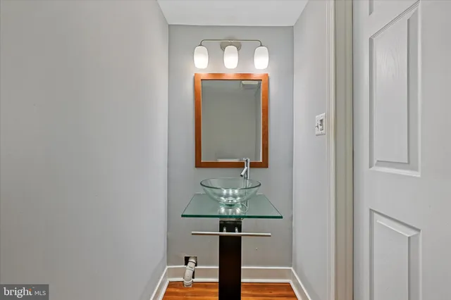 a view of bathroom with mirror