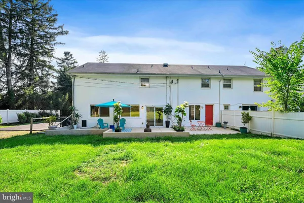 a view of yard with swimming pool and green space