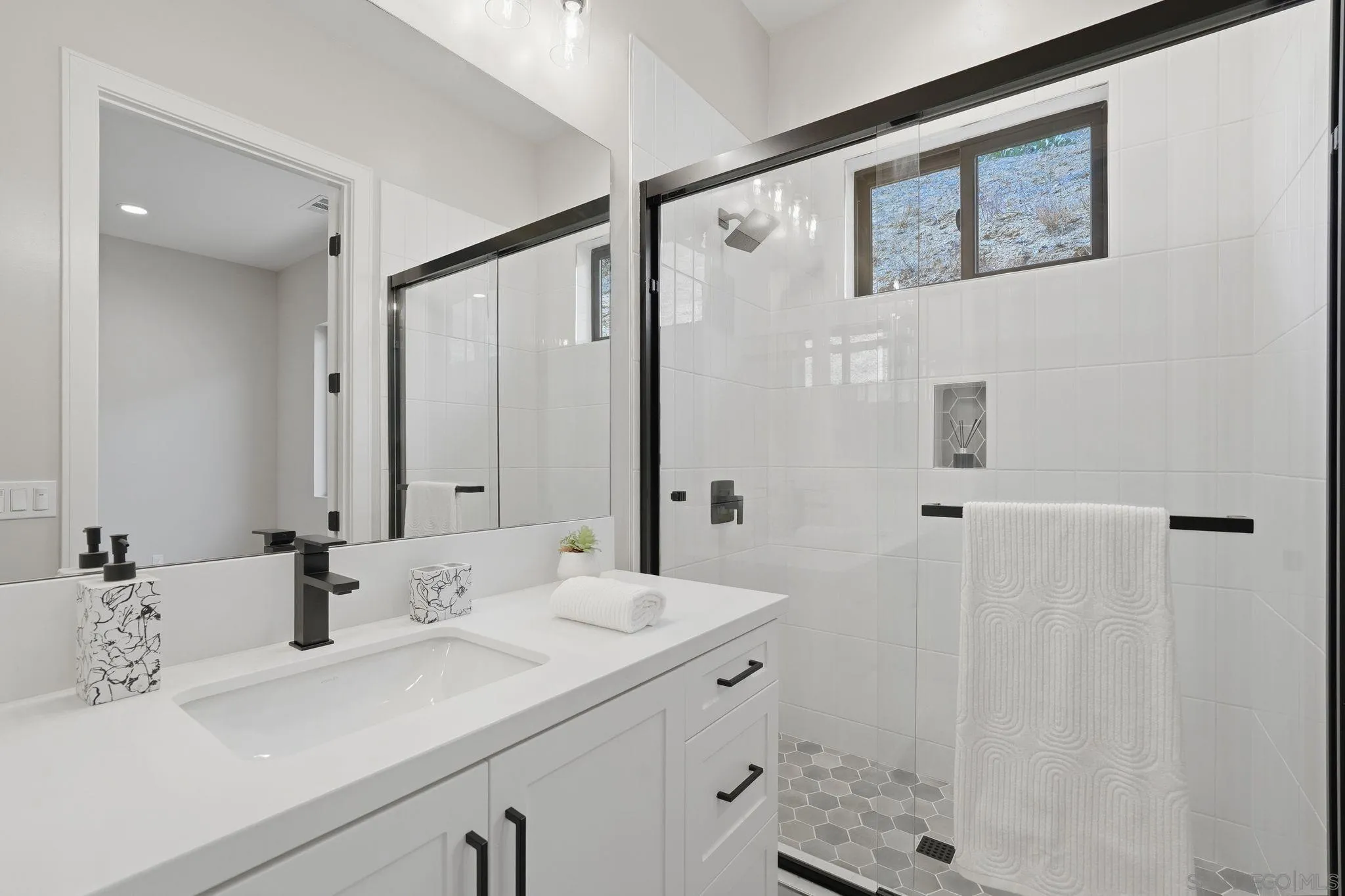 3916 Citrus Drive Fallbrook, CA 92028 - Photo 35 of 72 a bathroom with a sink and a mirror