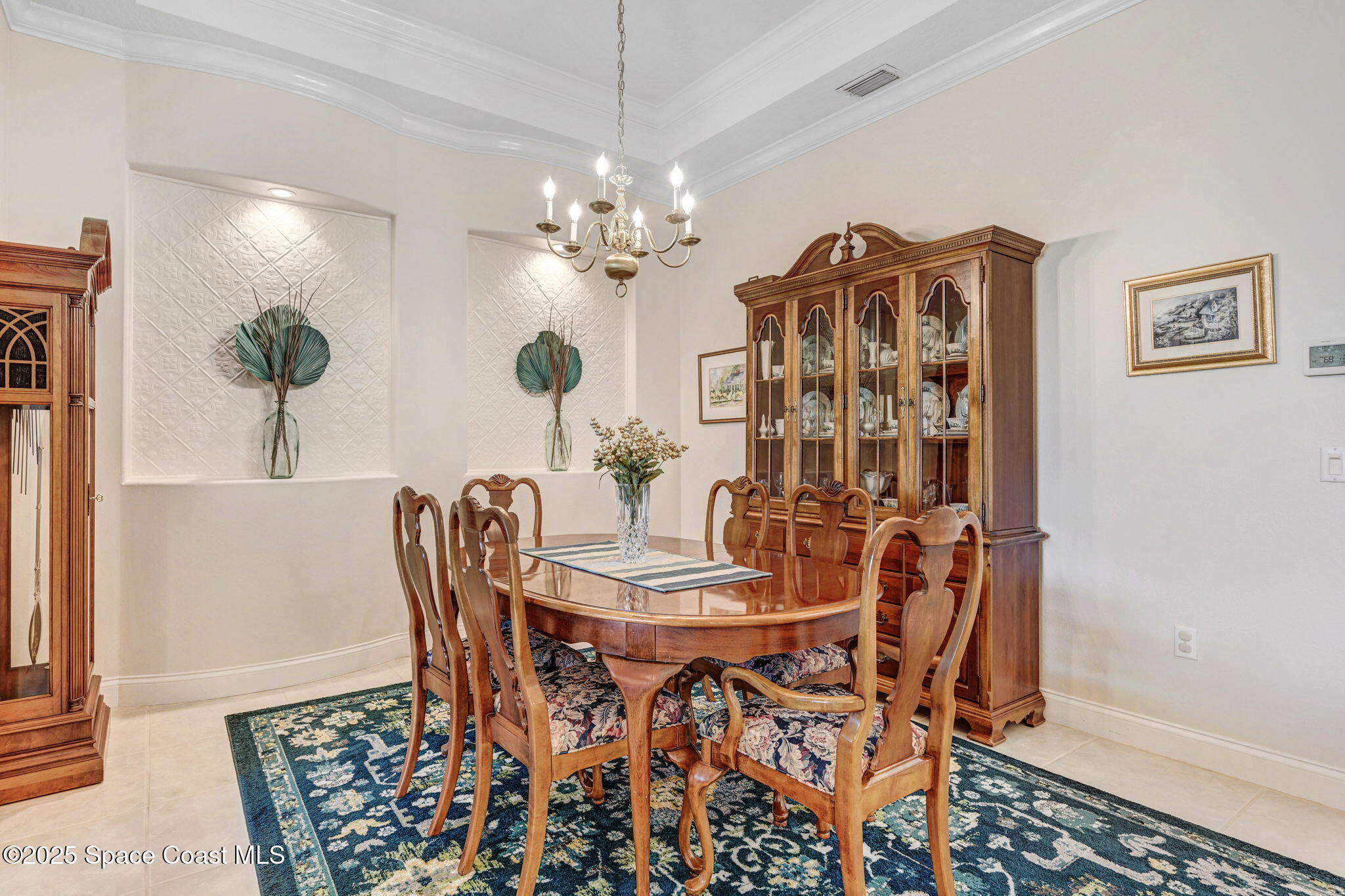 507 Royston Lane Melbourne, FL 32940 - Photo 20 of 52 a view of a dining room with furniture and chandelier