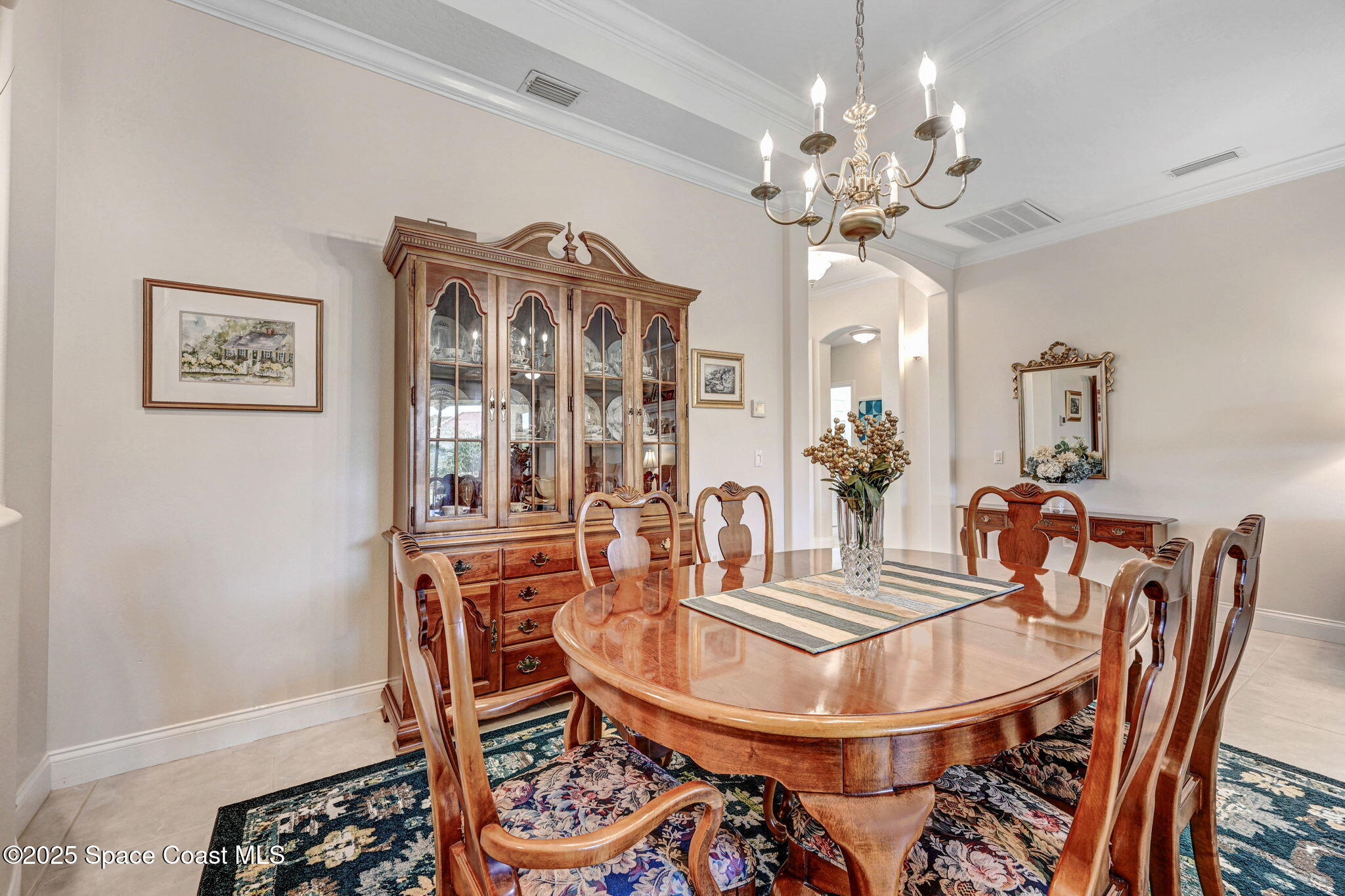 507 Royston Lane Melbourne, FL 32940 - Photo 21 of 52 a dining room with furniture and chandelier