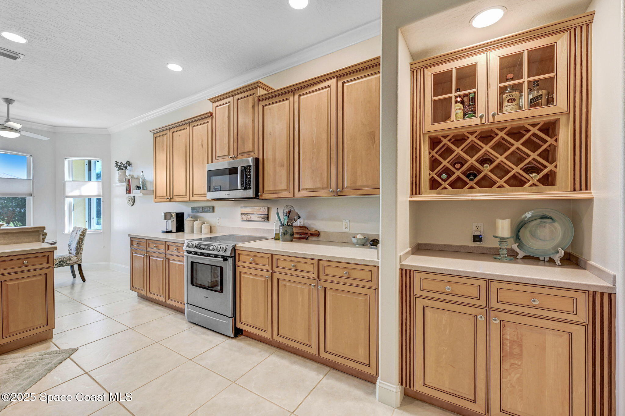507 Royston Lane Melbourne, FL 32940 - Photo 34 of 52 a kitchen with granite countertop a stove top oven sink and cabinets