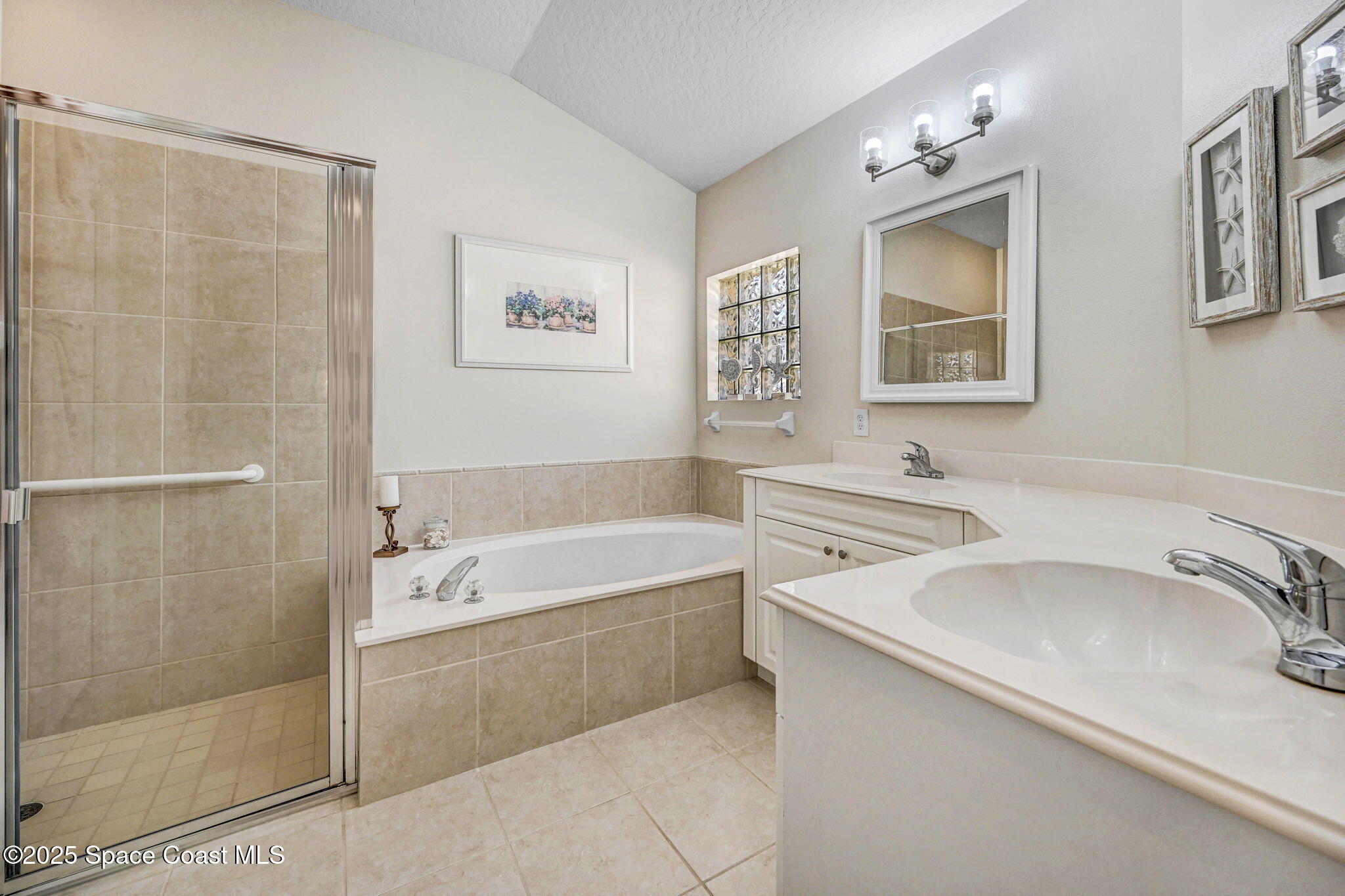 507 Royston Lane Melbourne, FL 32940 - Photo 39 of 52 a bathroom with a tub sink and mirror