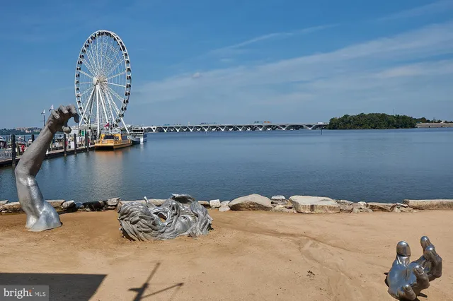 a view of a lake with a table and chairs