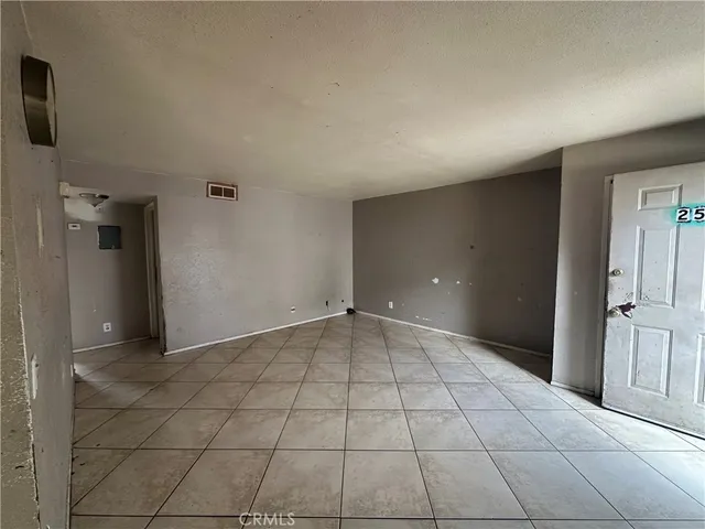 a view of an empty room and a window