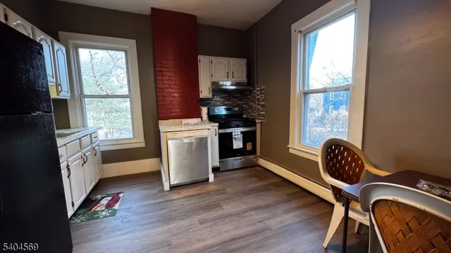 a view of a backyard with large trees