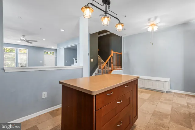 a kitchen that has a sink and a stove in it