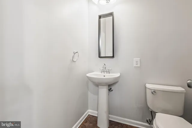 a bathroom with a sink toilet